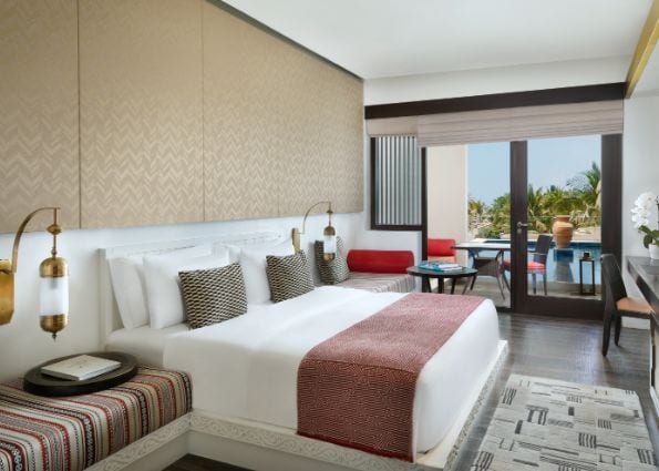 Anantara Al Baleed - Deluxe Room Bedroom